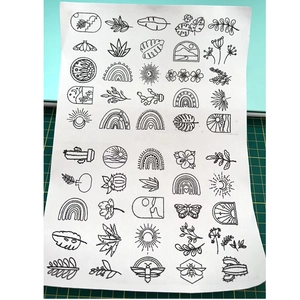 Bohemian patterns on water-soluble stabilizer with leaves, rainbows and floral designs