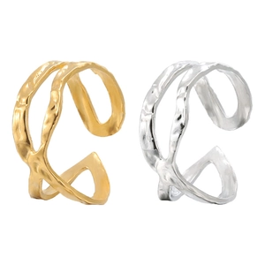Detail of cross open rings showing irregular hammered texture in gold and silver finish