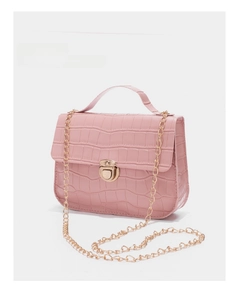 Detailed view of pink crocodile-embossed mini bag with gold chain and turn-lock closure