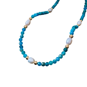 Elegant titanium steel necklace featuring turquoise beads and white freshwater pearls
