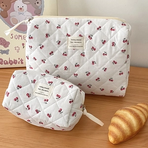 Quilted cotton cosmetic bag set with red cherry floral print and top zipper closure