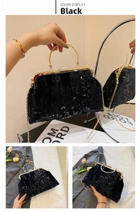 Detail of black sequin evening clutch with golden handle and pear-shaped crystal clasp