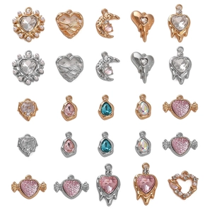 Set of 20 gold and silver alloy DIY jewelry charms with crystals and pearls on white background