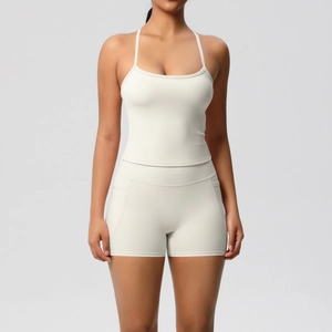 Detail of cream yoga set with side pocket shorts and ribbed high-stretch sports tank top