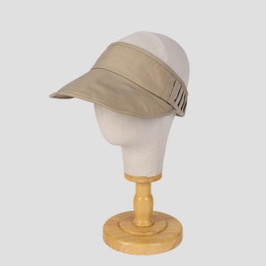 Minimalist khaki sun visor hat with wide brim for UV protection on mannequin head