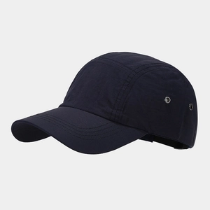 Detail view of quick-dry navy blue baseball cap with metallic side ventilation eyelets