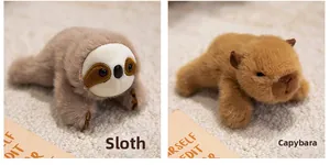 Detail view of plush sloth and capybara magnets in soft faux fur laying on carpet