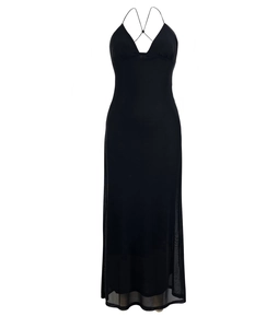 Detail of deep V-neckline and sheer mesh layered hem on a black bodycon dress