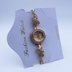 Luxurious rose gold quartz watch with butterfly bracelet and crystal diamond bezel