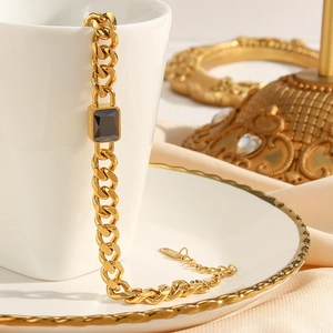 18K gold plated Cuban link bracelet with black square zircon on elegant white ceramics