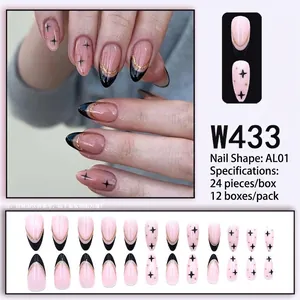 Pink almond press-on nails with black French tips and golden glitter star design