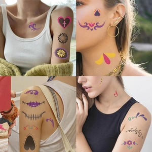 Close-up of colorful Halloween facial tattoo stickers with floral and artistic patterns