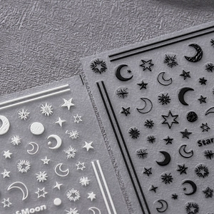 3D embossed nail stickers featuring black and white celestial star and moon patterns
