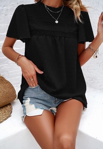 Close-up of black short sleeve top featuring lace trim and ruffled high neck detail