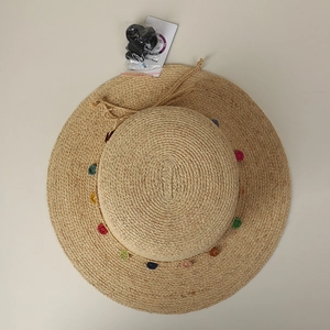 Boho raffia sun hat with colorful crochet dots and adjustable wind strap accessory