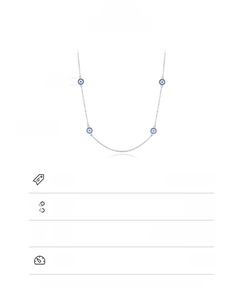Macro detail of 925 sterling silver evil eye necklace with four 5.7mm blue eye beads