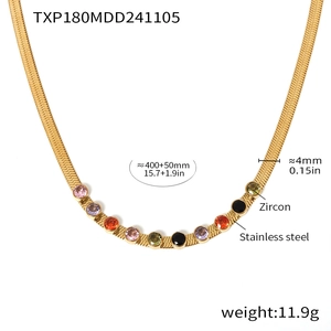 Detail of 18k gold plated stainless steel necklace with colorful zircon stone settings