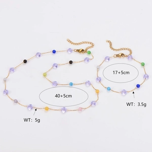 Detailed view of stainless steel flower necklace and bracelet with size specifications