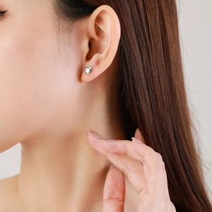 Elegant s925 silver mini apple stud earrings for women on a model with warm lighting