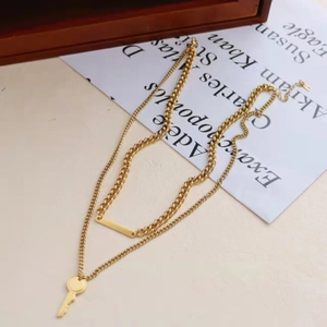 Creative gold titanium steel double-layer necklace with key and bar pendant set