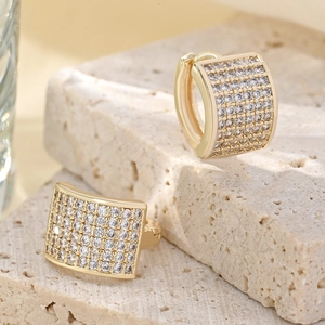Macro view of 14K gold plated hoop earrings with micro-pave white cubic zirconia stones