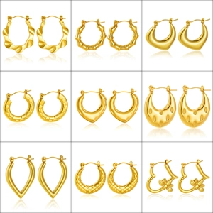 Collection of nine gold-plated stainless steel earrings in various fashionable geometric shapes