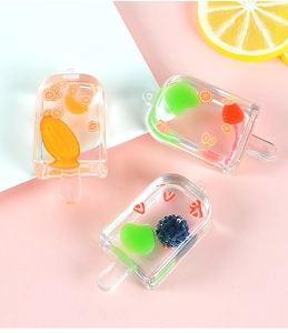 Detailed view of creative resin popsicle charms with realistic faux fruit slices