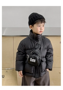 Close-up of black polyester crossbody bag with white Cute lettering for stylish kids