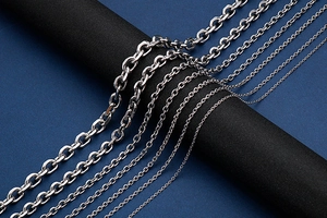 Detailed close-up of various stainless steel chain link sizes and textures for DIY jewelry