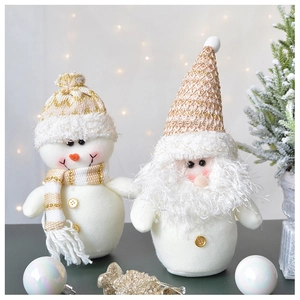Detailed plush texture of snowman and Santa dolls with gold knitted hats and buttons