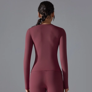 Rear view detail of slim fit long sleeve yoga top in deep red stretch fabric
