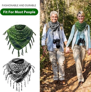 Detail of durable green and black cotton desert shemagh scarves with fringe tassels