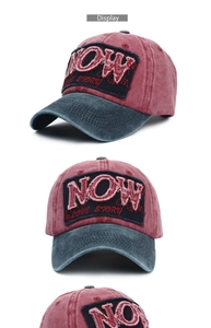 Detail of vintage washed baseball cap featuring stitched 'NOW LOVE STORY' patch