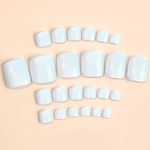 Glossy light blue press-on toenails set in various sizes on a neutral background