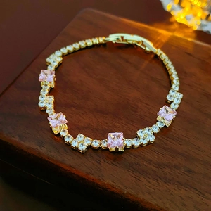 Detail of pink zircon square crystal bracelet on a premium wooden display box