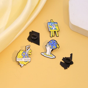 Creative enamel pins set featuring lemon drink, alien easel and starry night motifs