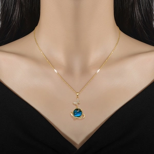 Elegant gold titanium steel necklace featuring a blue planet pendant with a crystal butterfly