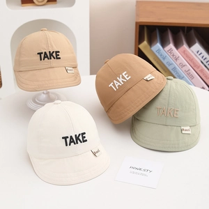 Detail of four colorful breathable sun hats with TAKE 3D embroidery for toddlers