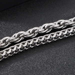 Close-up of double-layered stainless steel Cuban and rope chains for men with silver finish