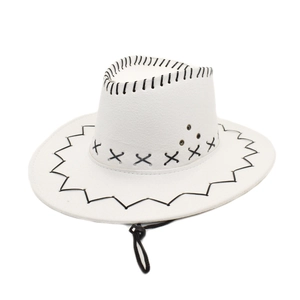 Detail of white cowboy hat featuring black cross-stitching and metal eyelets with wind cord