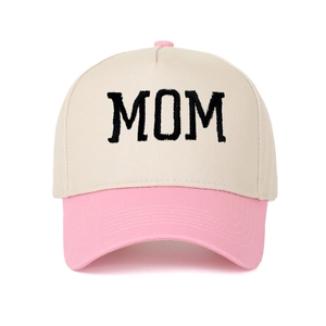 Close-up of pink and beige trucker hat featuring high-quality MOM embroidery on cotton canvas
