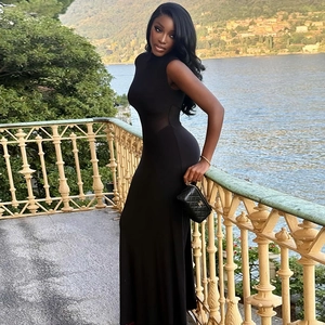 Elegant sleeveless black maxi dress featuring a sheer mesh patchwork waist for women