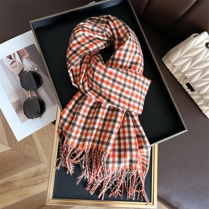British style red brown plaid scarf with tassels on tray with fashion accessories