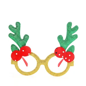 Christmas party glasses with gold glitter frames, red berries and green glitter antlers