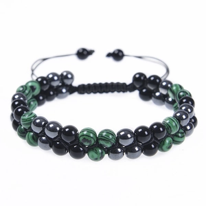 Detail view of double-layer woven beaded bracelet with adjustable cord and hematite beads