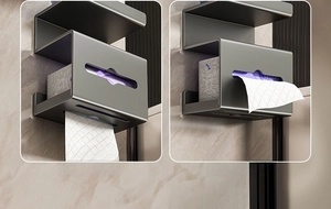 Wall-mounted grey metal tissue box with dual outlets and top shelf for bathroom storage
