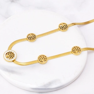 Gold tree of life crystal pendant necklace with hollow circular design on snake chain