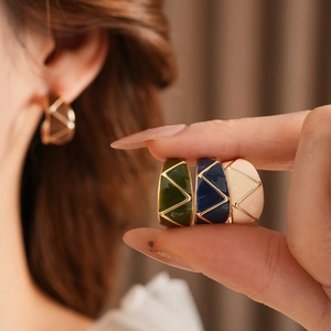 Vintage enamel C-shaped hoop earrings shown in green, dark blue, and beige colors