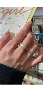 Close-up of brushed silver S925 sterling silver ring with minimalist matte texture