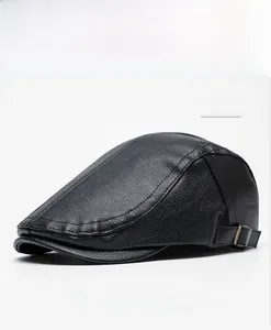 Detail of black faux leather duckbill cap with bronze metal buckle and lychee texture